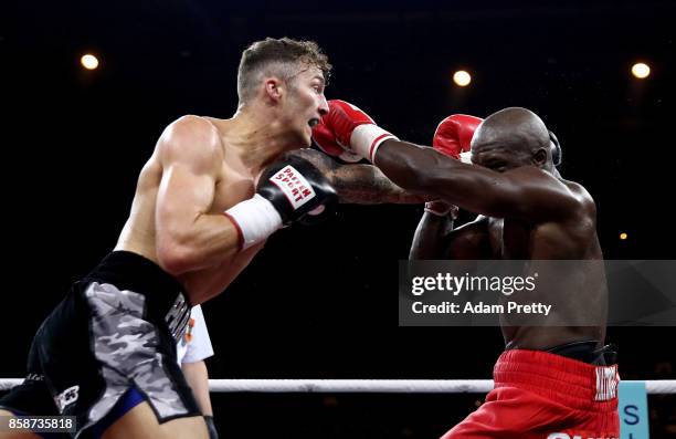 Mantingu Kindele of Belgium and Zach Parker of Great Britain exchange punches during their Super Middleweight fight at Hanns-Martin-Schleyer Halle on...