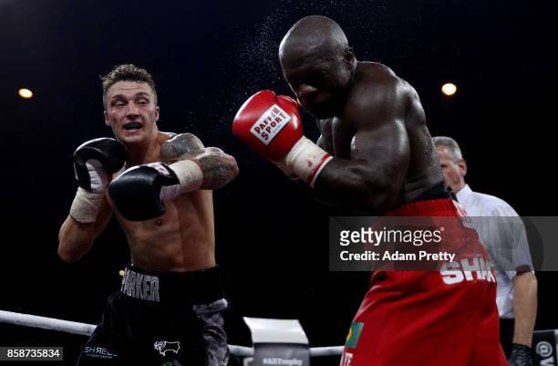 Mantingu Kindele of Belgium and Zach Parker of Great Britain exchange punches during their Super Middleweight fight at Hanns-Martin-Schleyer Halle on...