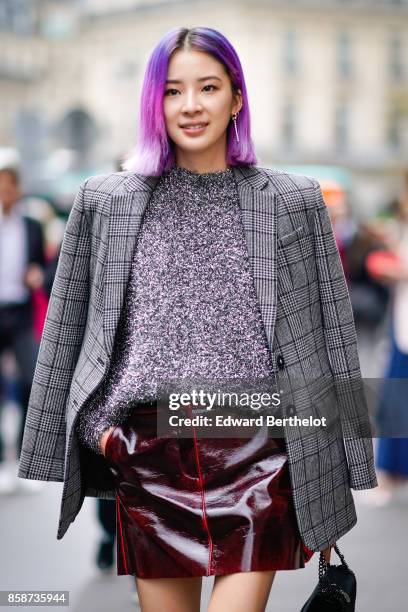 Irene Kim wears a gray tartan blazer jacket, a gray top, a leather skirt, glitter chanel boots, has purple pink hair, outside Stella Mccartney,...