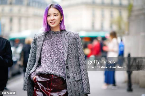 Irene Kim wears a gray tartan blazer jacket, a gray top, a leather skirt, glitter chanel boots, has purple pink hair, outside Stella Mccartney,...