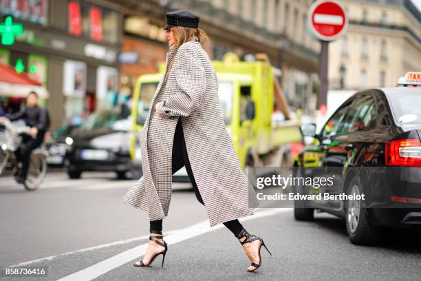 Anna Dello Russo wears a beret hat, a gray coat, heels, outside Stella Mccartney, during Paris Fashion Week Womenswear Spring/Summer 2018, on October...