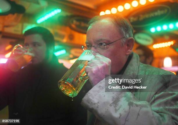 Stephan Weil, German Social Democrat and governor of the state of Lower Saxony, drinks a beer while campaigning in the Lower Saxony state elections...