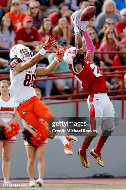 Heath Harding of the Miami Ohio Redhawks intercepts a pass intended for Jared Wyatt of the Bowling Green Falcons during the first half on October 7,...