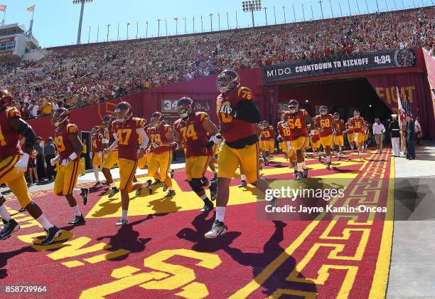 Trojans players run on to the the field for the game against the Oregon State Beavers at the Los Angeles Memorial Coliseum on October 7, 2017 in Los...