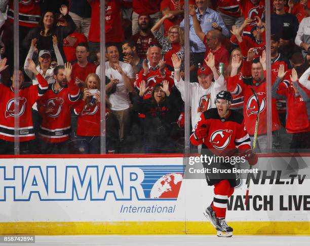 John Moore of the New Jersey Devils celebrates his shorthanded goal at 14:00 of the third period against the Colorado Avalanche at the Prudential...
