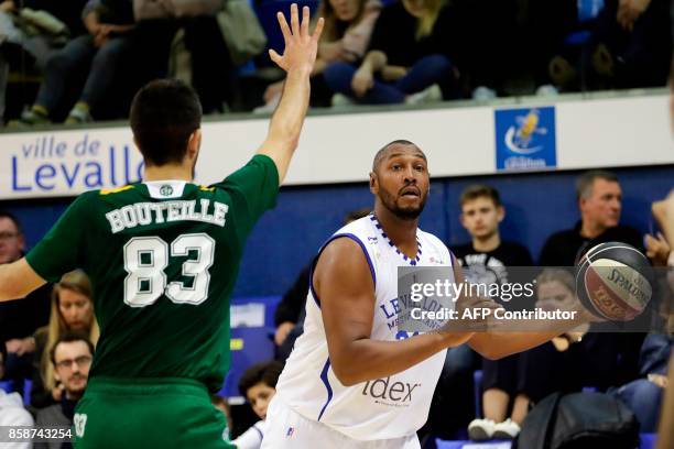 French Levallois Metropolitans' power forward Boris Diaw works around Limoges' shooting guard Axel Bouteille during the Pro A basketball match...