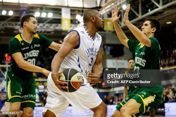 French Levallois Metropolitans' power forward Boris Diaw works around Limoges' shooting guard Axel Bouteille during the Pro A basketball match...