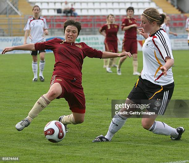 Oxana Potapova of Russia and Claudia Goette of Germany fight for the ball during the U17 Women international friendly match between Germany and...