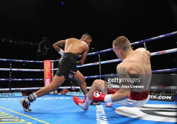 Conor Benn knocks down Nathan Clarke for the second time during the Welterweight Championship fight at Manchester Arena on October 7, 2017 in...