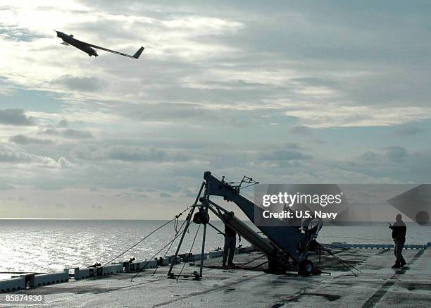 In this handout provided by the U.S. Navy, a Scan Eagle unmanned aerial vehicle launches from the flight deck of the amphibious assault ship USS...