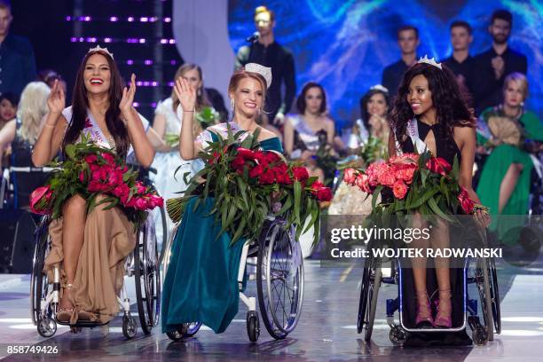 Miss Belarus Aleksandra Chichikova , winner of the Miss Wheelchair World contest beauty pageant, first runner-up Lebohang Monyatsi from South Africa...
