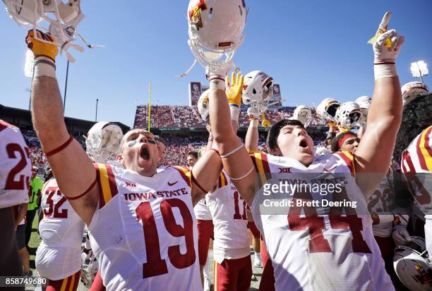 Wide receiver Trever Ryen and linebacker Bobby McMillen III of the Iowa State Cyclones celebrate after the game against the Oklahoma Sooners at...