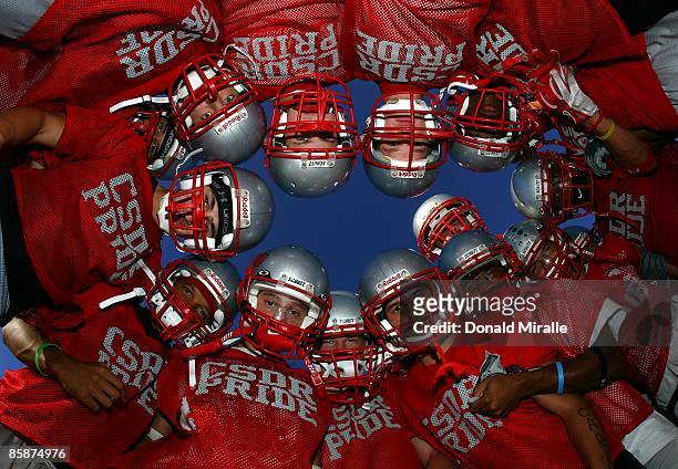 The California School of the Deaf Riverside Football Team huddle during their practice on October 13, 2005 at the Riverside School of the Deaf in...
