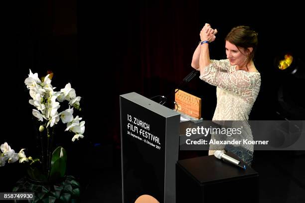 Seraina Nyikos gives her acceptance speech after receiving the Treatment Award on stage during the Award Night Ceremony during the 13th Zurich Film...