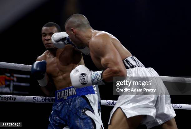 Avni Yildirim of Turkey and Chris Eubank Jr. Of Great Britain exchange punches during the Super Middleweight World Boxing Super Series fight at...