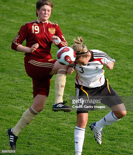 Irina Zinovyeva of Russia and Laura Vetterlein of Germany jump for a headerl during the U17 Women international friendly match between Germany and...