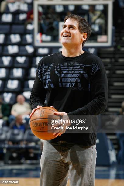 Owner Mark Cuban of the Dallas Mavericks shoots the ball before the game between the Dallas Mavericks and the Memphis Grizzlies on April 3, 2009 at...