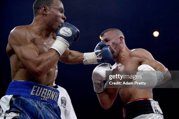 Avni Yildirim RL) of Turkey is hit by Chris Eubank Jr. Of Great Britain exchange punches during the Super Middleweight World Boxing Super Series...