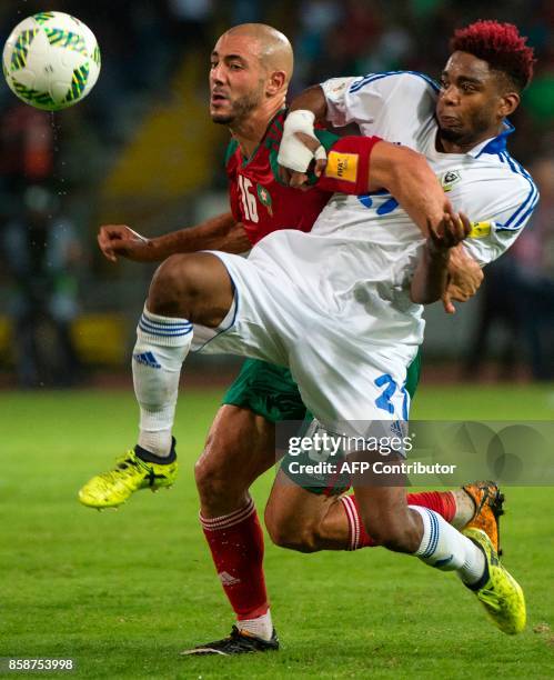 Morocco's Amrabet Noureddine vies for the ball with Gabon's Wachter Claude during their FIFA world Cup 2018 Group C football match between Morocco...