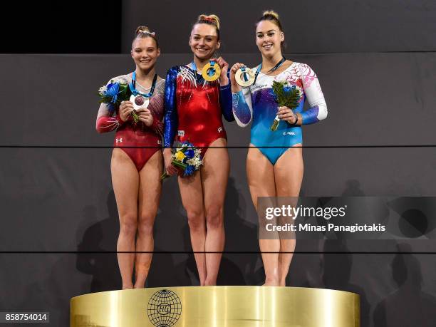 Jade Carey of The United States of America , Maria Paseka of Russia and Giulia Steingruber of Switzerland hold up their medals after competing on the...