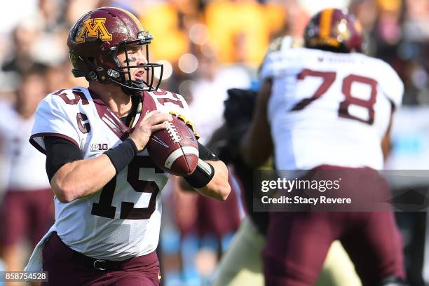 Conor Rhoda of the Minnesota Golden Gophers drops back to pass against the Purdue Boilermakers during the first half at Ross-Ade Stadium on October...