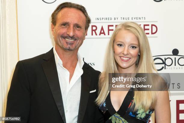 Production Designer Jean Jacques Calabrese and Actress Kelly Washington attend the Premiere Of Epic Pictures Releasings' "Trafficked" at the Aero...