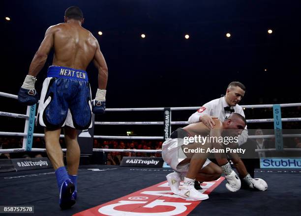 Avni Yildirim of Turkey is knocked down by Chris Eubank Jr. Of Great Britain during the Super Middleweight World Boxing Super Series fight at...