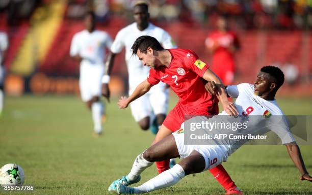 Tunisian striker Youssef Msekni vies with Guinea's player Soumah Seydouba during the World Cup 2018 qualifying football match between Guinea and...