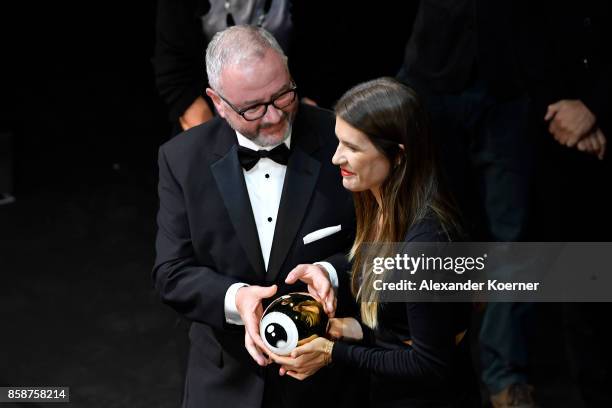 President of the jury for international documentary Simon Kilmurry hands over the award to Kaja Eggenschwiler in subsitution for the movie 'Machines'...