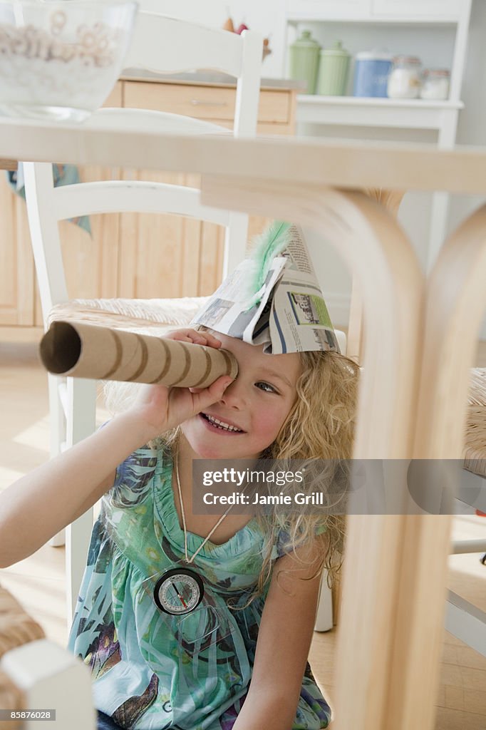 Young Girl Pretending to be a Sailor in Kitchen