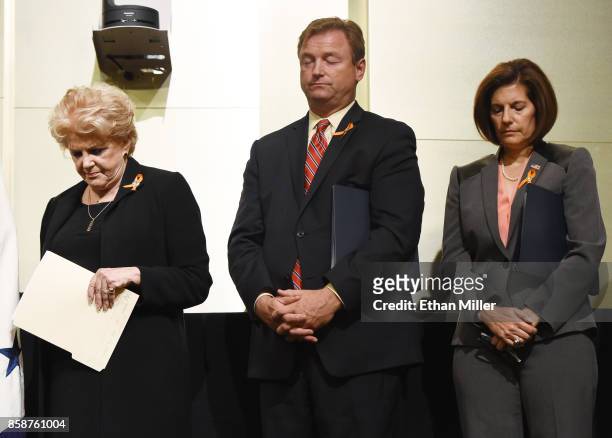 Las Vegas Mayor Carolyn Goodman, U.S. Sen. Dean Heller and U.S. Sen. Catherine Cortez Masto stand during a prayer at the culmination of a faith unity...