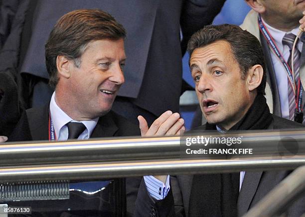 Paris-Saint-Germain football club's president Sebastien Bazin chats with French president Nicolas Sarkozy before the UEFA Cup quarter finals first...