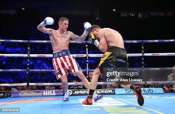 Anthony Crolla rocks Ricky Burns during the last round of their Lightweight contest at Manchester Arena on October 7, 2017 in Manchester, England.