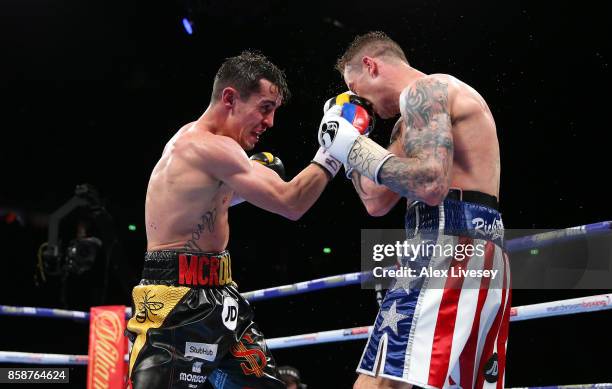 Anthony Crolla lands a right shot on Ricky Burns during the Lightweight contest at Manchester Arena on October 7, 2017 in Manchester, England.