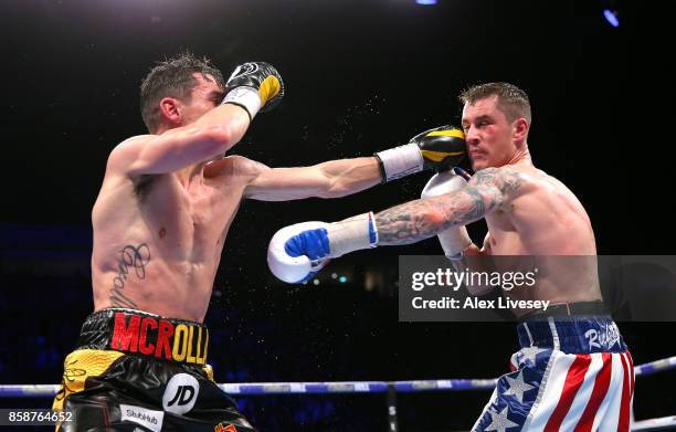 Anthony Crolla lands a left shot on Ricky Burns during the Lightweight contest at Manchester Arena on October 7, 2017 in Manchester, England.