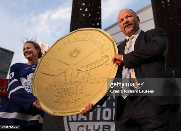 Former Leafs captain Wenel Clark and Royal Canadian Mint President and CEO, Sandra Hanington unveil the new Canadian 1 dollar coin honouring the...