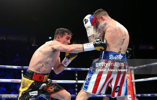 Anthony Crolla lands a right body shot on Ricky Burns during the Lightweight contest at Manchester Arena on October 7, 2017 in Manchester, England.
