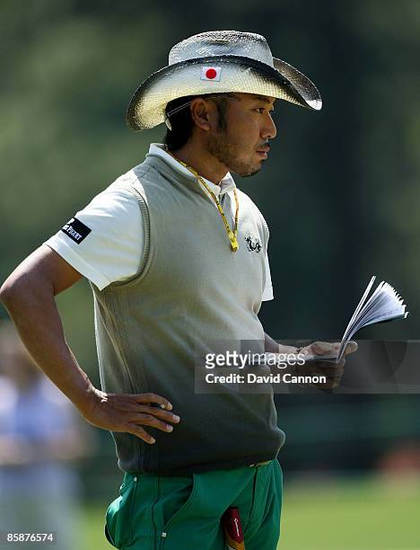 Shingo Katayama of Japan looks over his yardage book during the first round of the 2009 Masters Tournament at Augusta National Golf Club on April 9,...