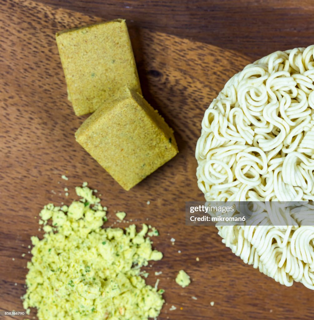 Instant noodle with spicy seasoning powder and bouillon cubes