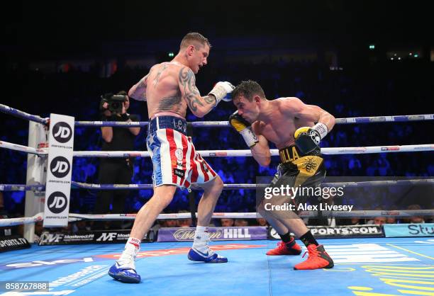 Anthony Crolla and Ricky Burns exchange blows during the Lightweight contest at Manchester Arena on October 7, 2017 in Manchester, England.