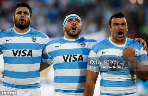 Lucas Noguera Paz, Nahuel Tetaz Chaparro and Agustin Creevy of Argentina sing the national anthem prior to The Rugby Championship match between...