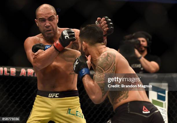 Brad Tavares punches Thales Leites of Brazil in their middleweight bout during the UFC 216 event inside T-Mobile Arena on October 7, 2017 in Las...