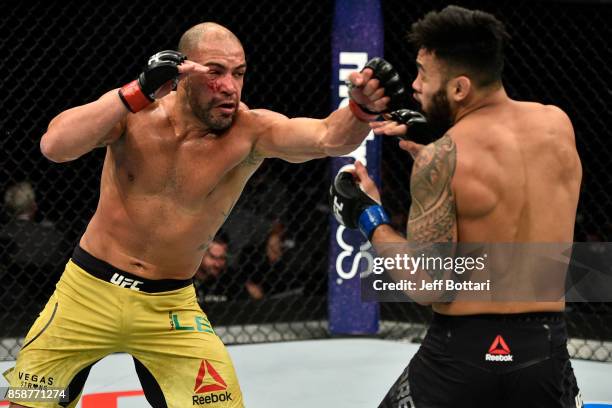 Thales Leites of Brazil punches Brad Tavares in their middleweight bout during the UFC 216 event inside T-Mobile Arena on October 7, 2017 in Las...