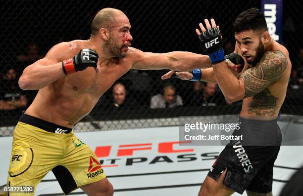 Thales Leites of Brazil punches Brad Tavares in their middleweight bout during the UFC 216 event inside T-Mobile Arena on October 7, 2017 in Las...