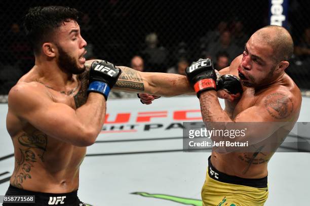 Brad Tavares punches Thales Leites of Brazil in their middleweight bout during the UFC 216 event inside T-Mobile Arena on October 7, 2017 in Las...