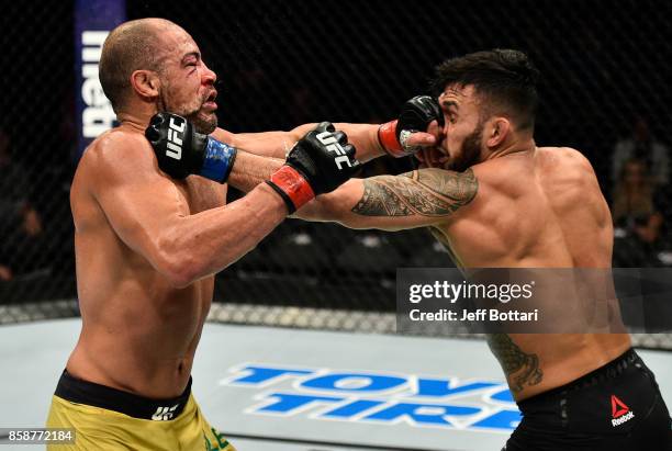 Thales Leites of Brazil and Brad Tavares trade punches in their middleweight bout during the UFC 216 event inside T-Mobile Arena on October 7, 2017...