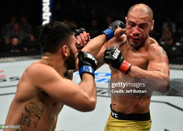 Brad Tavares punches Thales Leites of Brazil in their middleweight bout during the UFC 216 event inside T-Mobile Arena on October 7, 2017 in Las...