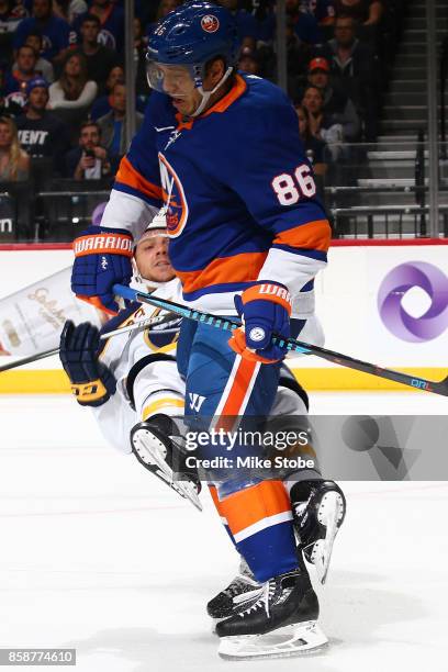 Nikolay Kulemin of the New York Islanders collides with Sam Reinhart of the Columbus Blue Jackets during the game at Barclays Center on October 7,...