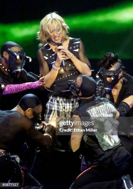 Madonna performs with dancers during the first of two sold-out shows at the MGM Grand Garden Arena during her Drowned World Tour September 1, 2001 in...