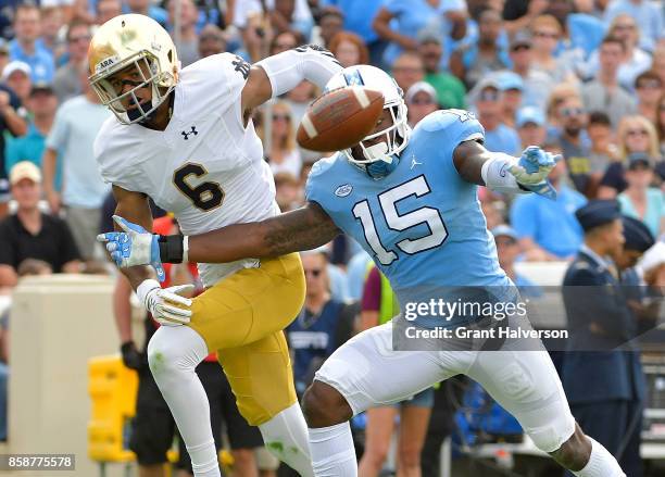 Donnie Miles of the North Carolina Tar Heels defends a pass to Equanimeous St. Brown of the Notre Dame Fighting Irishduring the game at Kenan Stadium...